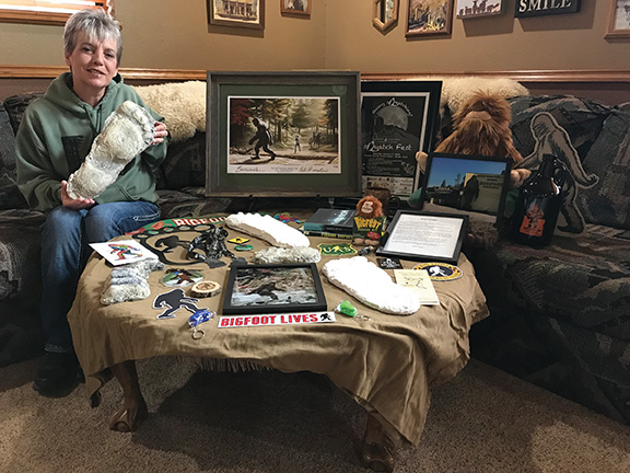 Darlene Masters with her collection of Bigfoot memorabilia.